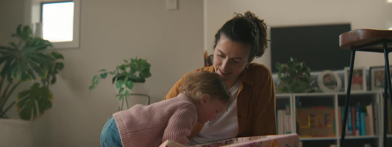Mother playing with her little daughter