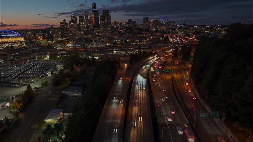 Downtown Seattle comes to life on a Friday night as the sunset paints the sky with beautiful colors