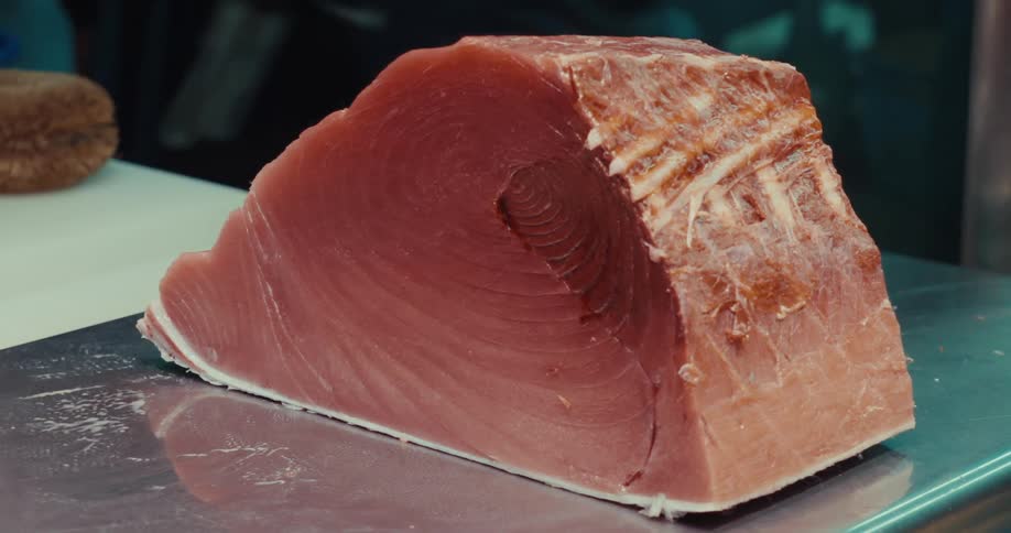 A clip of a processed fish on a steel tray