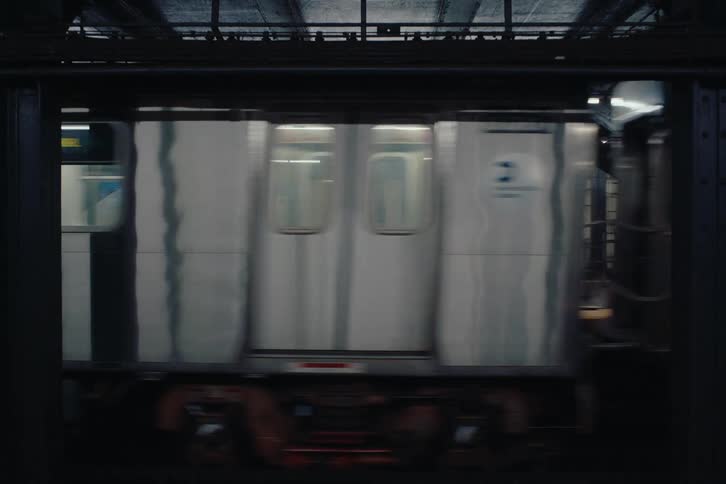 A clip of a boy waiting at the trains station