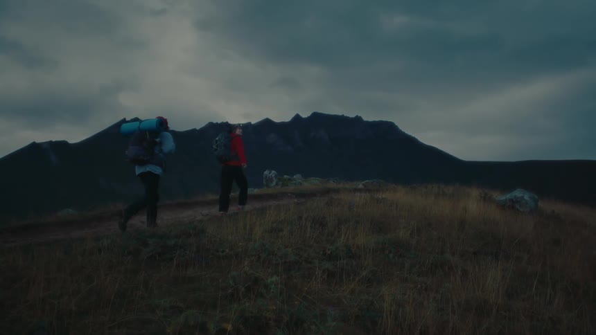 A clip of hikers hiking a mountain