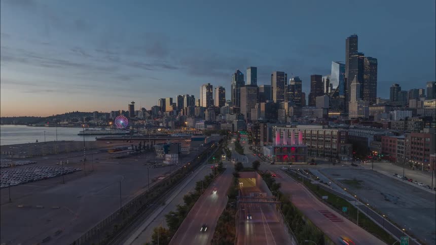 Low traverse over the SoDo industrial area as traffic and ferries flow in and out of downtown Seattle