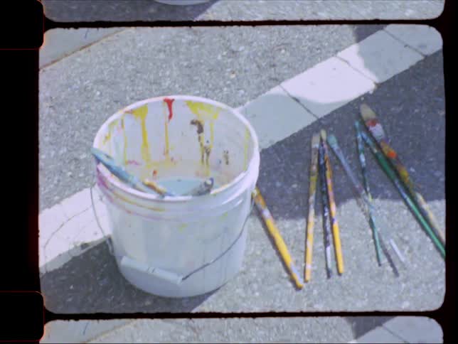 A clip of a paint bucket and brush
