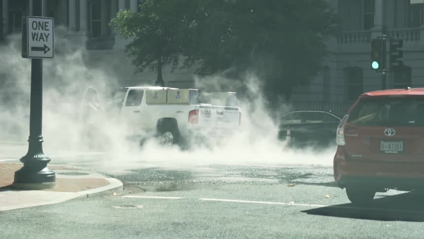Cars moving through the streets of a city
