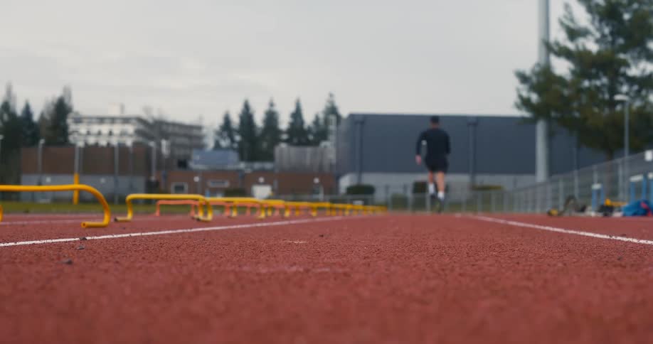 Man doing a sprint training on a track