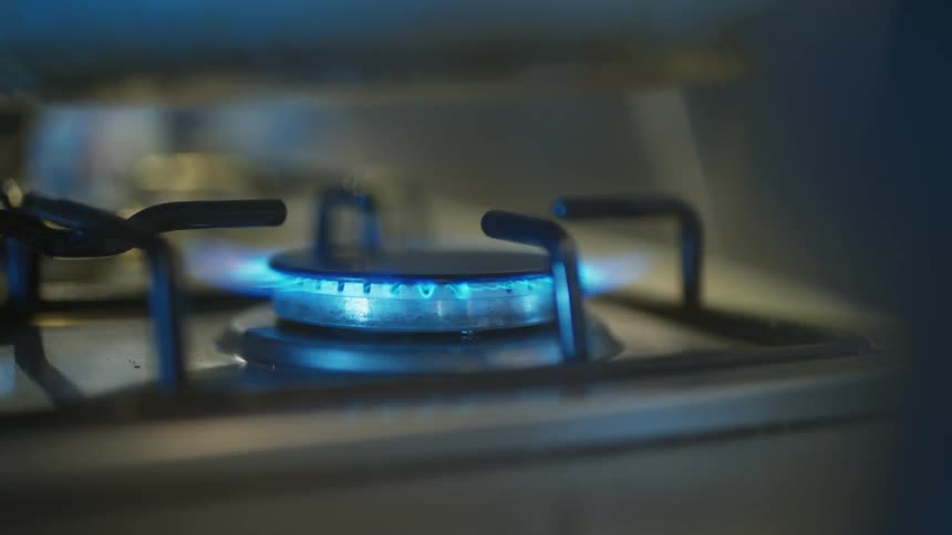 A pot is placed on a gas burner