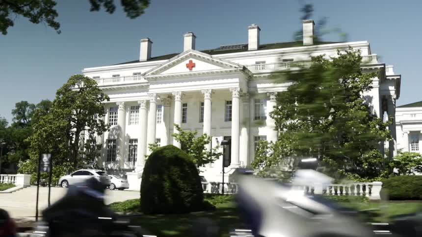 Classic white building with a red cross