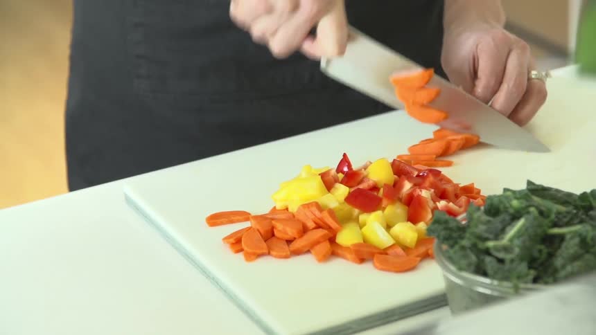 Person cutting some vegetables with a knife