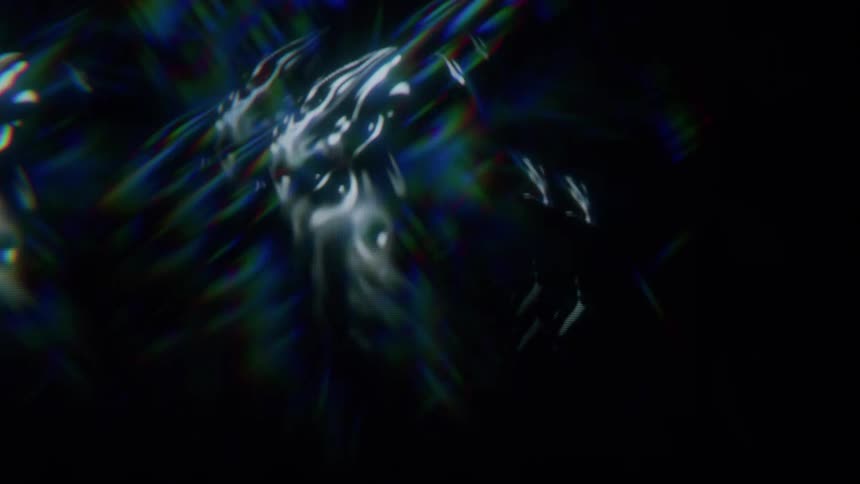 A gray animated blob expands and emits rainbows of light