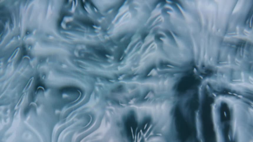 A closeup of swirling abstract patterns in shades of blue and gray