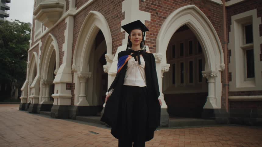 Young student with graduation gown