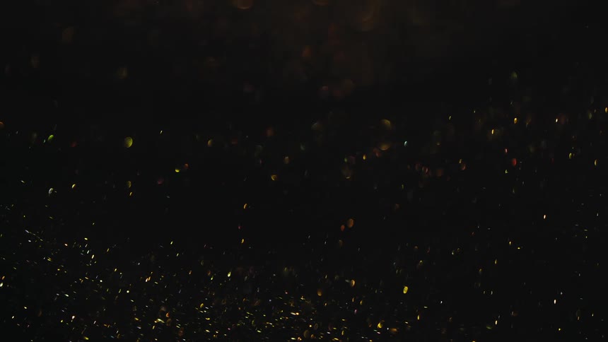 Dense liquid with glitter in abstract motion