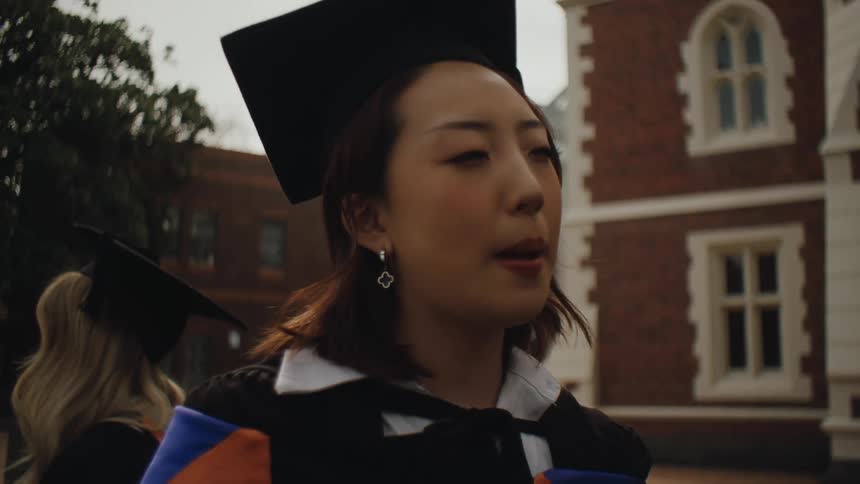 Portrait of a woman in graduation gown