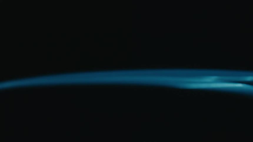 Two curved glowing blue lines spinning against a dark background