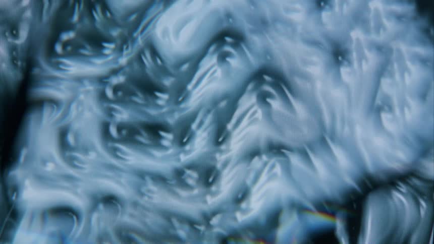 A close up clip of a moving white organism