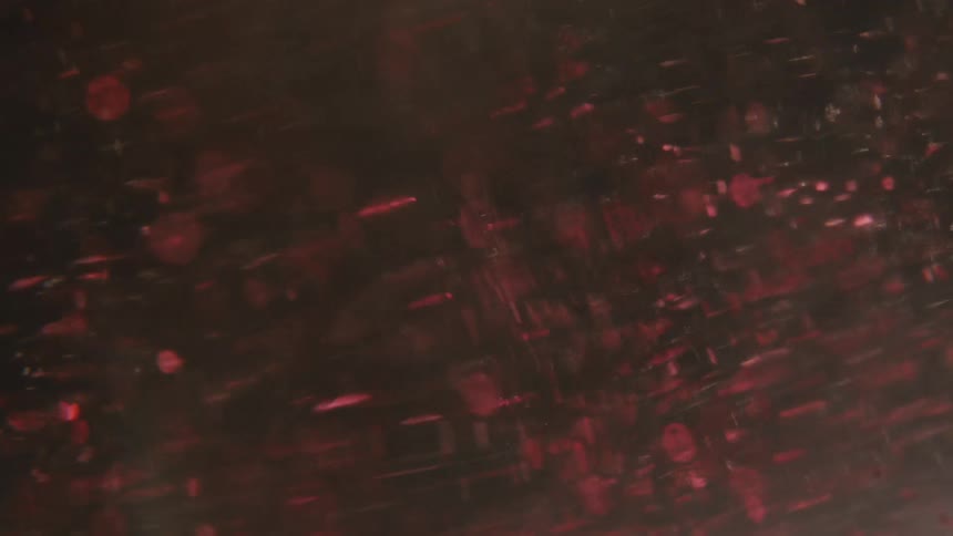 Liquid swirling with an abstract red glow