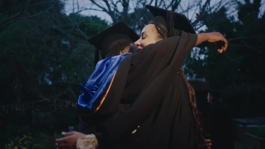 A clip of graduating students hugging