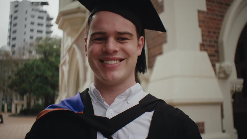 Man in graduation clothes