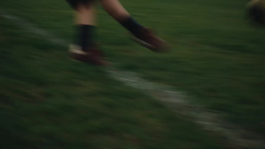 Boy kicking a ball towards the goal