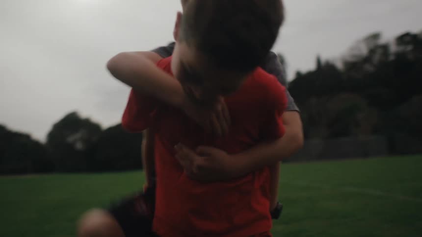 A clip of two children playing on the field