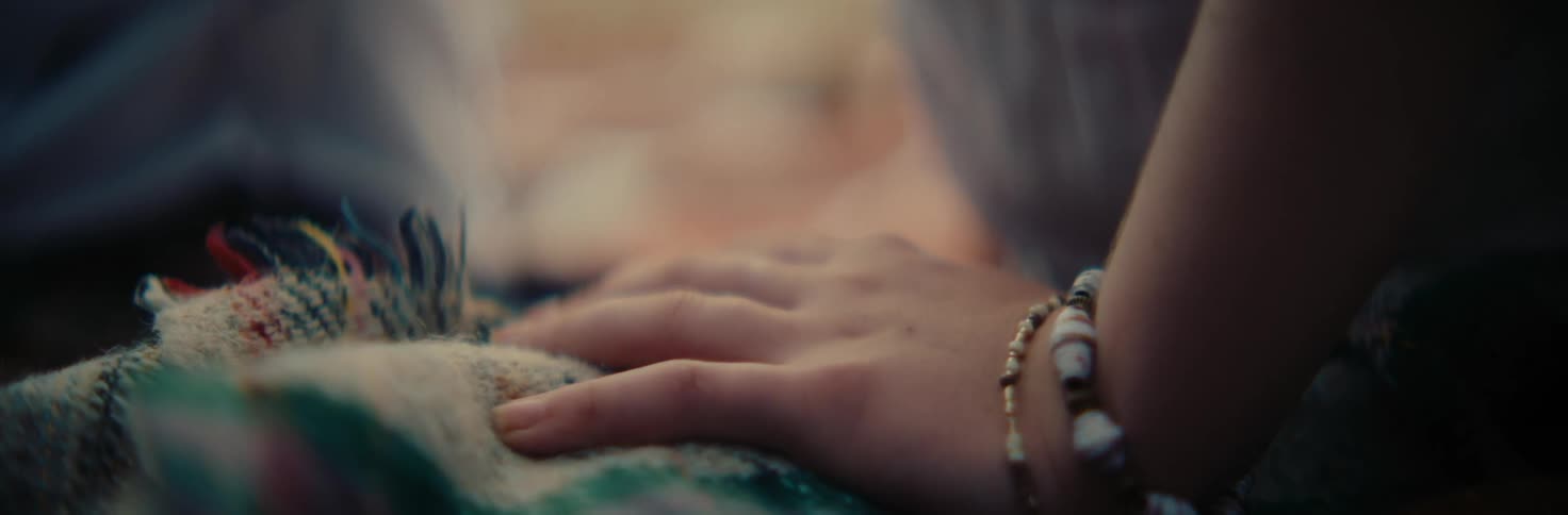 Close up of a persons hand with a bracelet