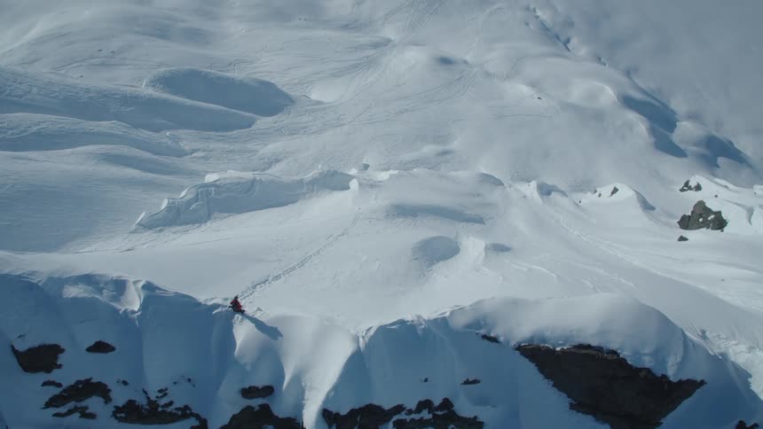 Deep snow covers a mountainous area