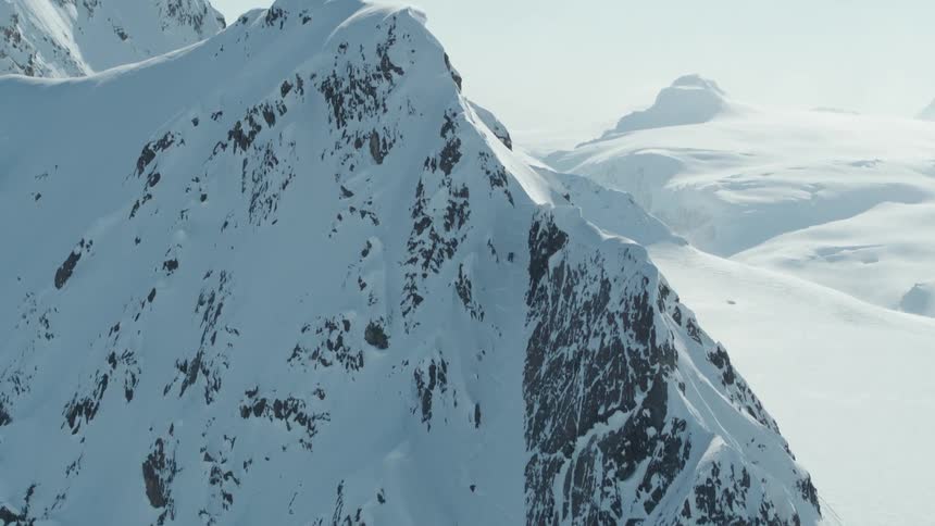 Steep high mountain range covered in snow
