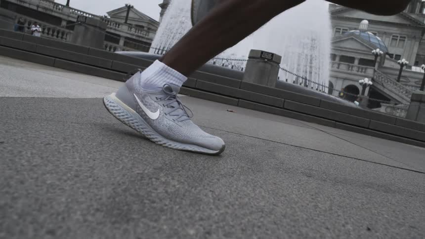 Leg of a person running in a public space