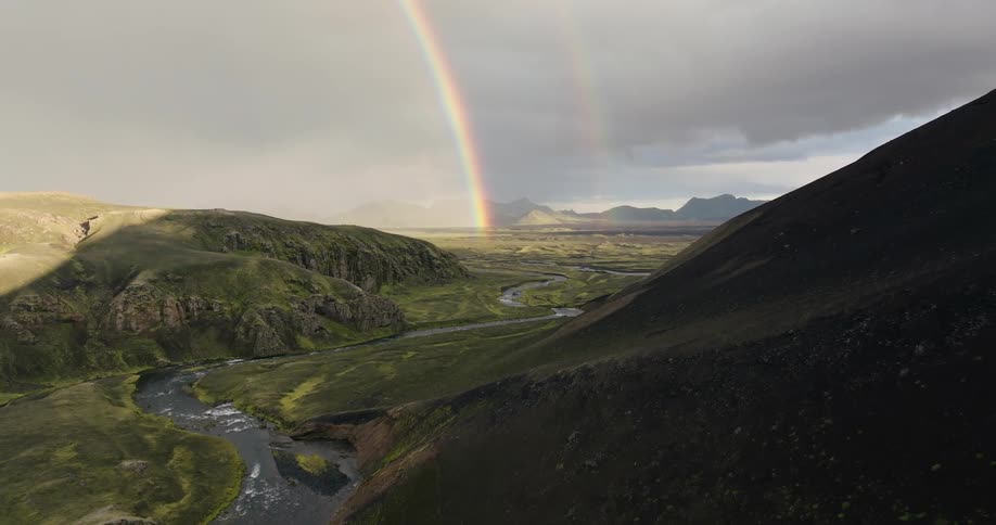 Storm clouds emit a bright rainbow in nature