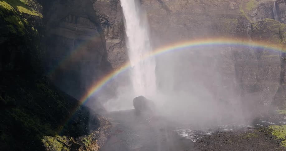 Valley with waterfall and rainbow