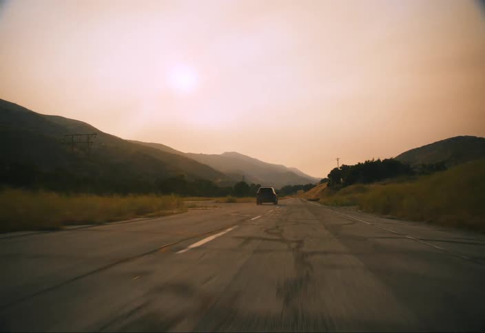 SUV races past and into the distance