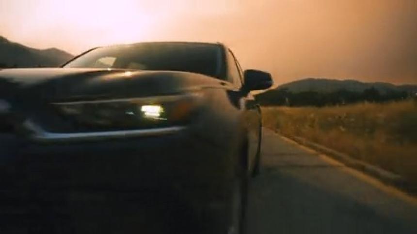 Car driving on a road during sunset