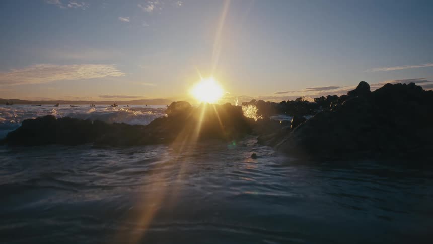 Waves crash over some rocks