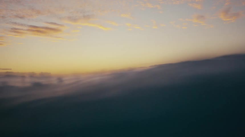 Silhouette of surfers in the ocean