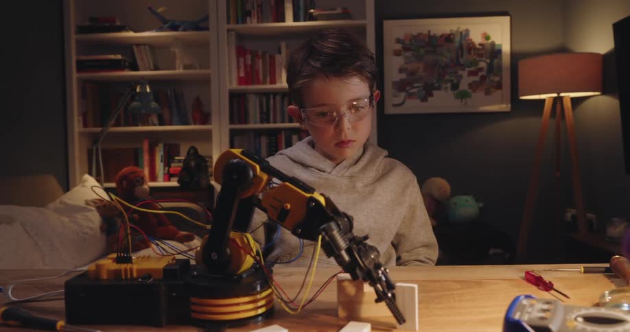 A clip of a kid in a room testing a robot