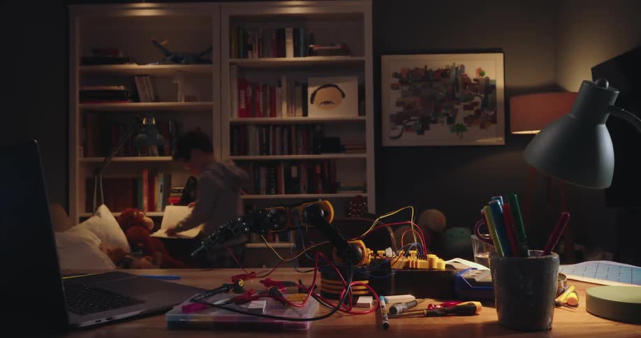 Child working on a project on the table in the living room