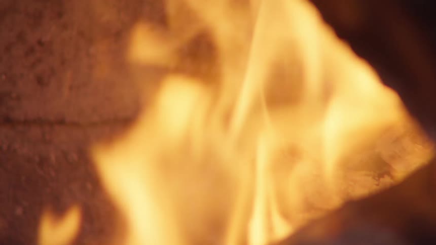 Close up of flames burning over coals