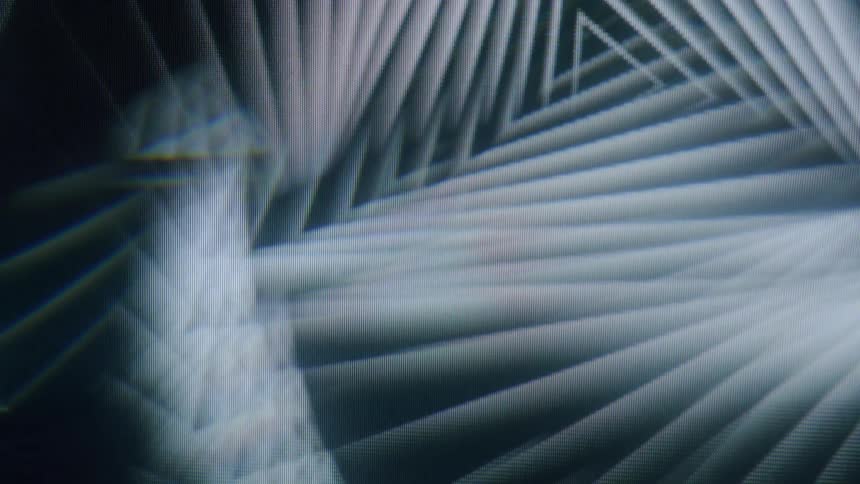A swirling pattern of faint glowing lines radiating outwards