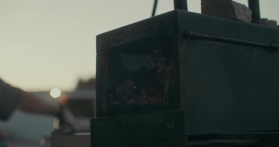 Man turning on the fire inside a welding machine