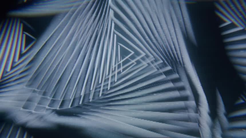 Digital animation involving multiple geometric shapes is briefly disrupted by signal noise