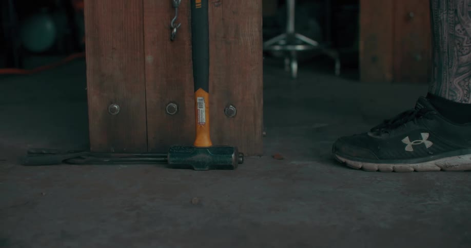 Person placing tools on the floor