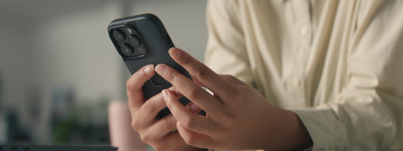 A woman is using her cell phone
