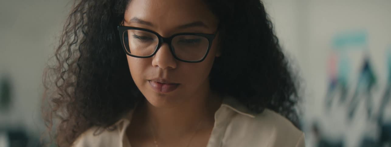 A woman is looking down and thinking about something