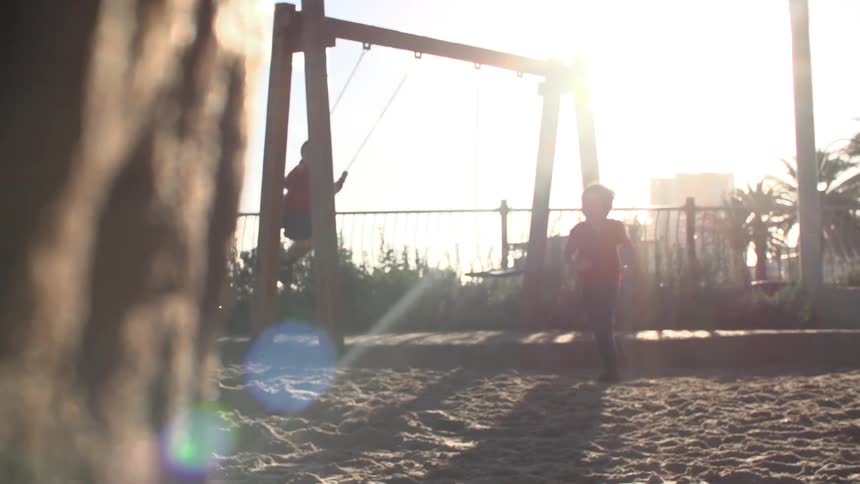 Children playing in a park on a sunny day