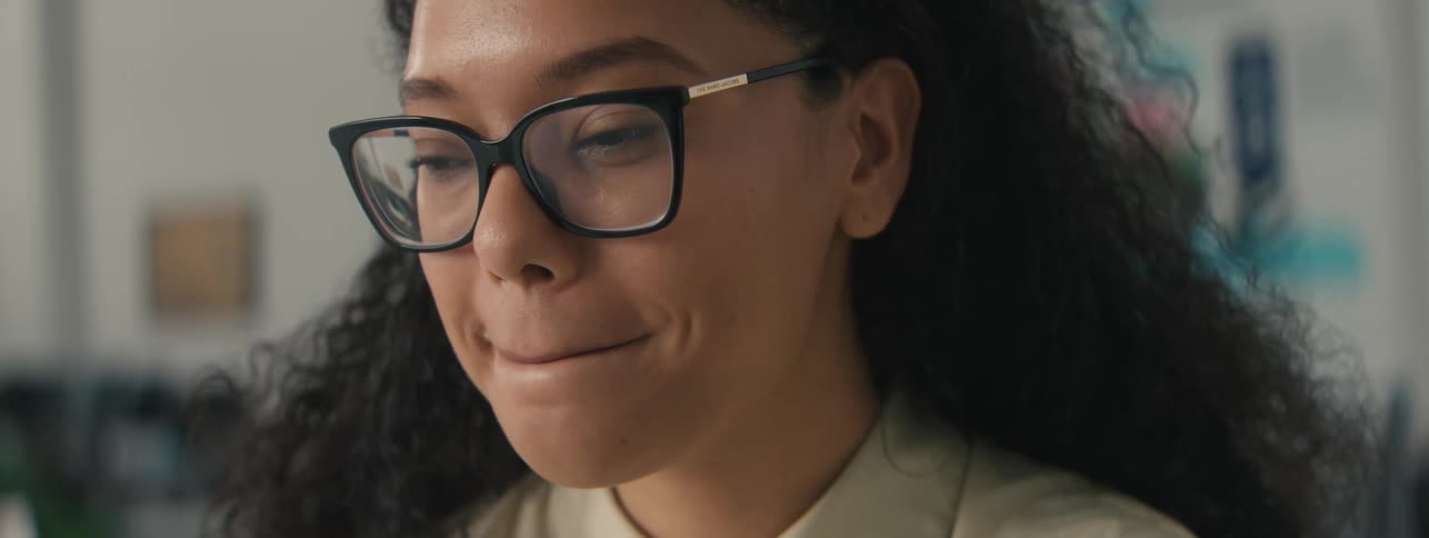 A woman is smiling and laughing