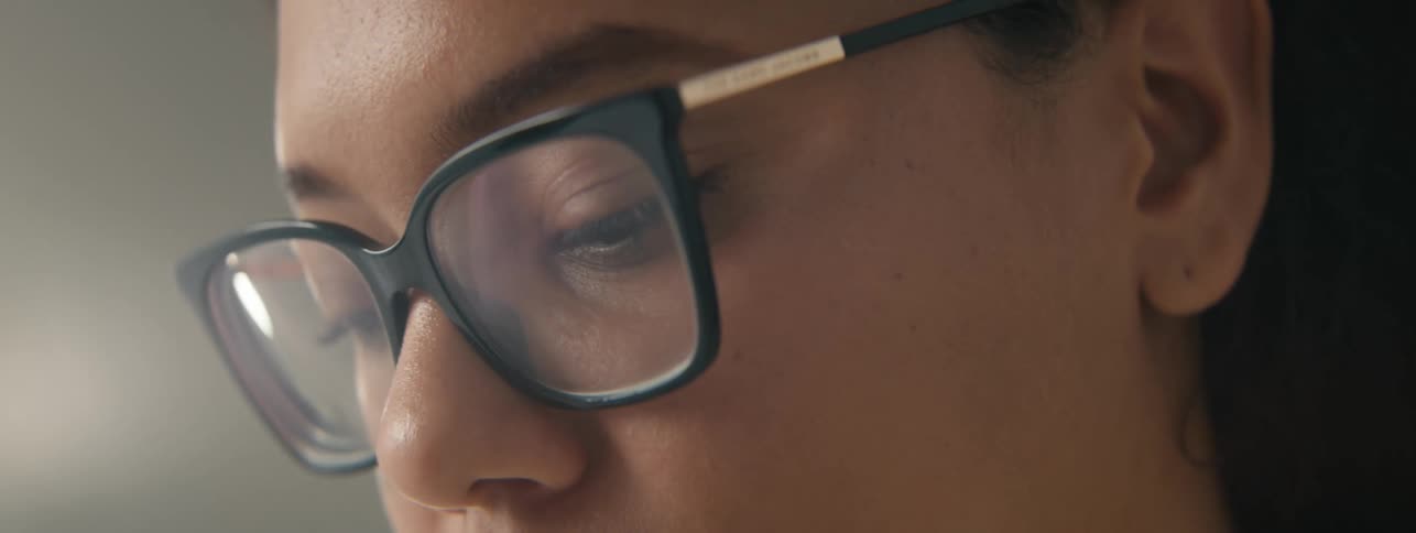 Portrait of a young woman with glasses nodding
