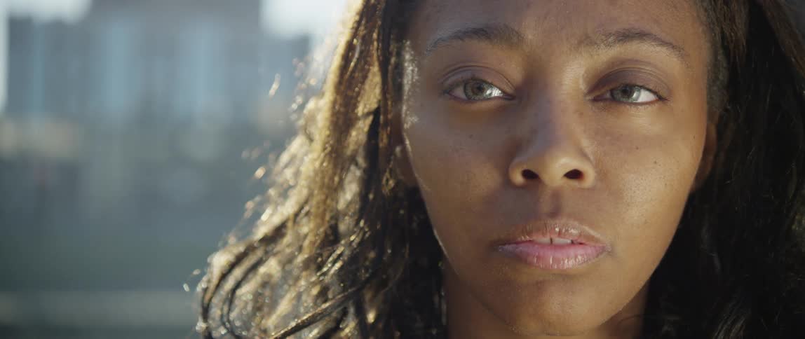The sun shines on a woman