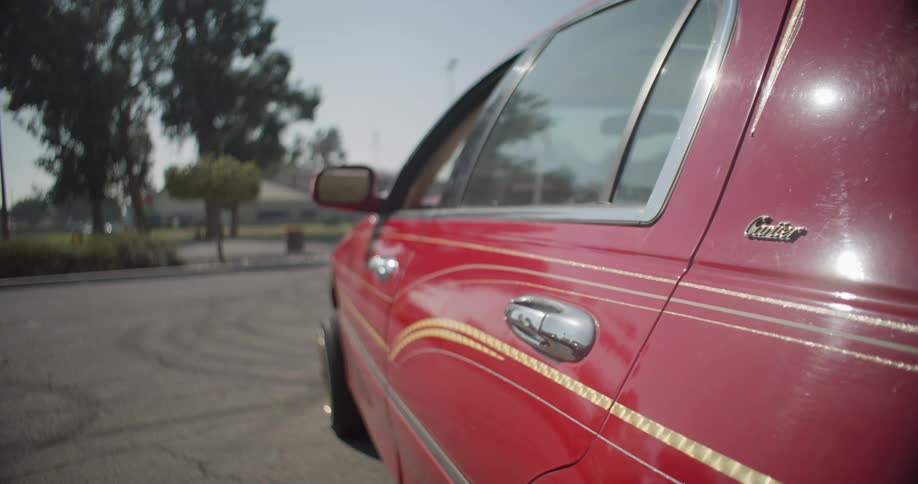 Side of a parked red vintage car