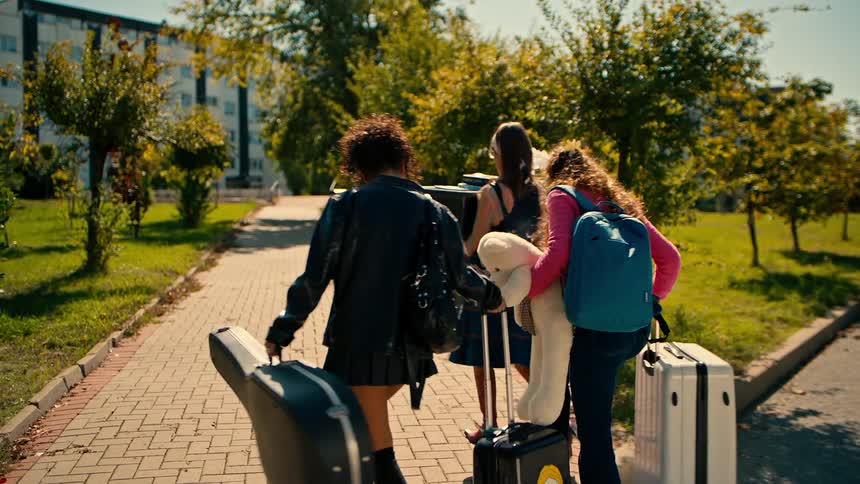 A clip of ladies walking with luggage