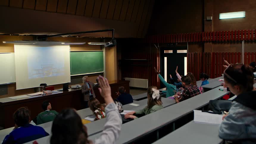A professor delivering a lecture to students on a college classroom